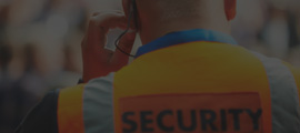 Event security wearing an orange vest