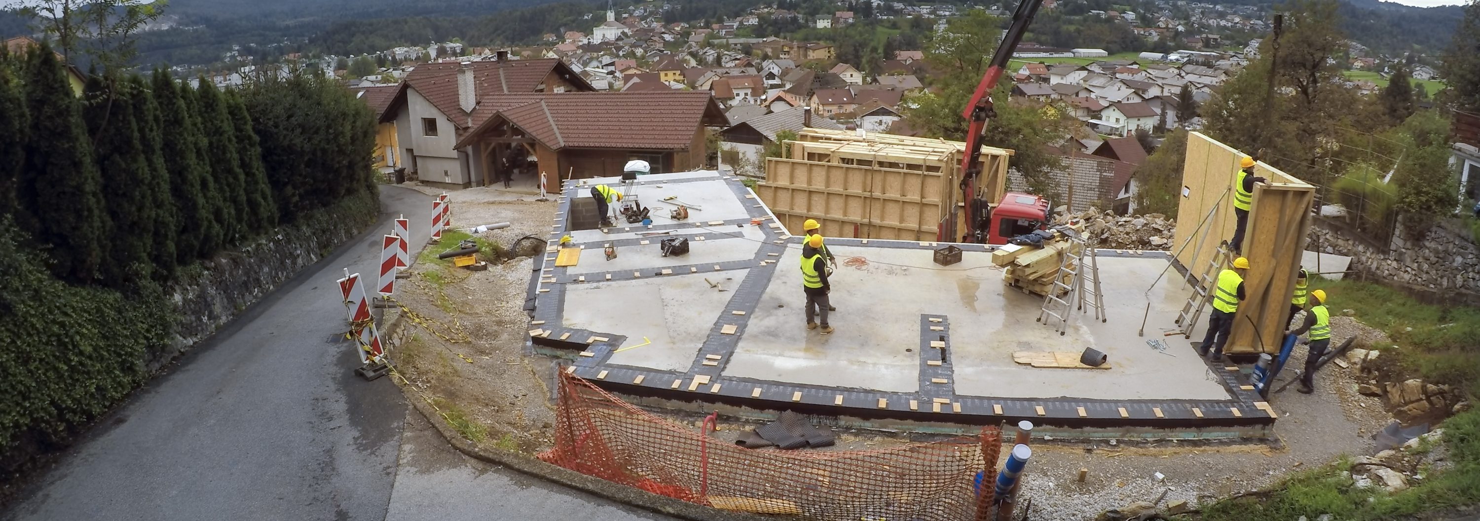 Construction workers working with construction frame at construction site.